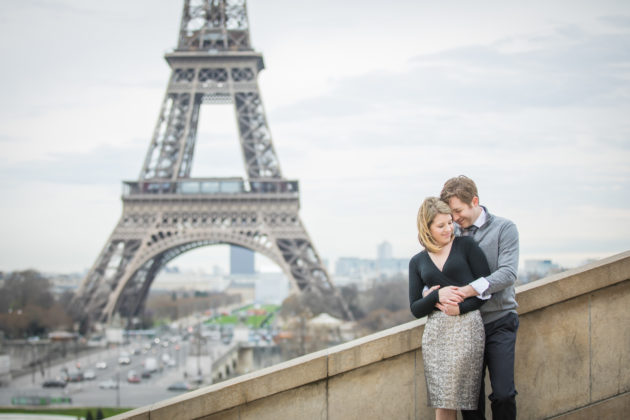 Couple in front of the Eiffel Tower in Paris
